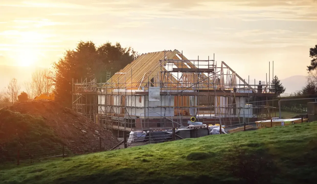 Building site with house under construction